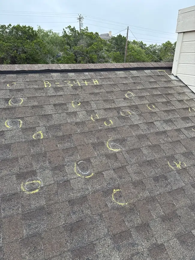 Post-storm roof inspection after hail damage