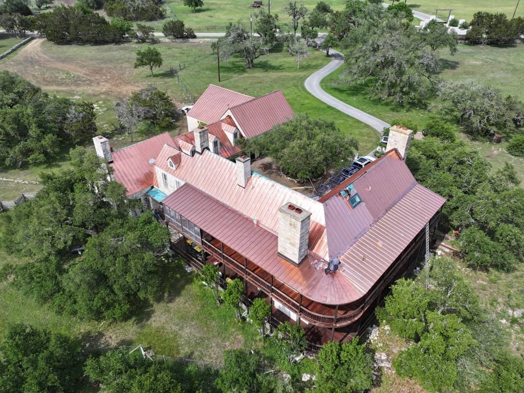 Copper standing seam roof installed by Next Gen Roofing & Construction