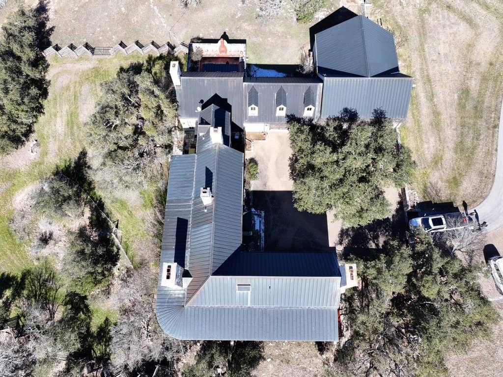 Copper standing seam roof installed by Next Gen Roofing & Construction