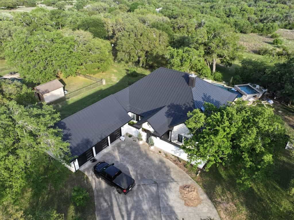 Standing seam metal roof installed by Next Gen Roofing & Construction on a Texas Hill Country home