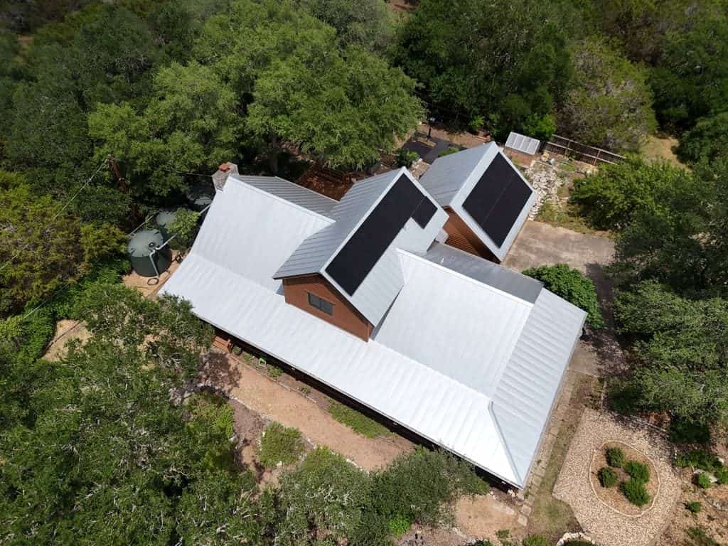 Standing seam metal roof installed by Next Gen Roofing & Construction on a Texas Hill Country home