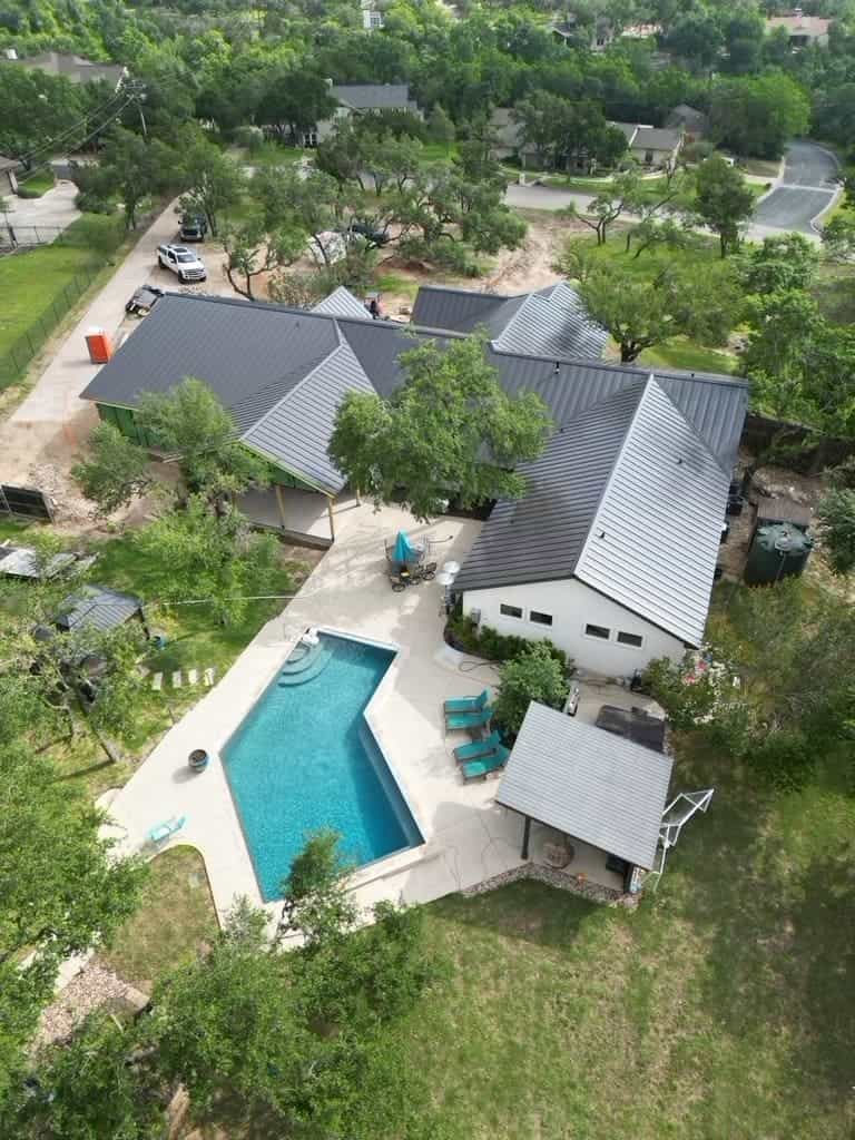Standing seam metal roof installed by Next Gen Roofing & Construction on a Texas Hill Country home