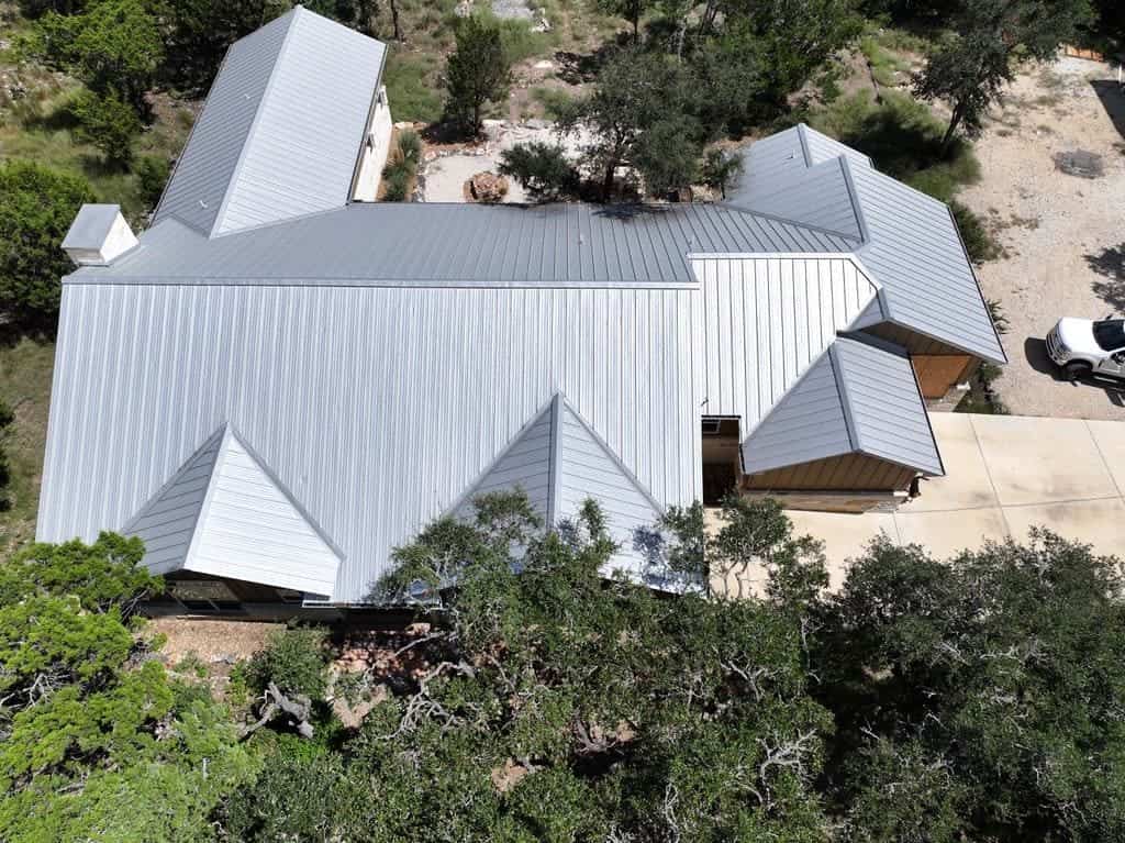 Standing seam metal roof installed by Next Gen Roofing & Construction on a Texas Hill Country home