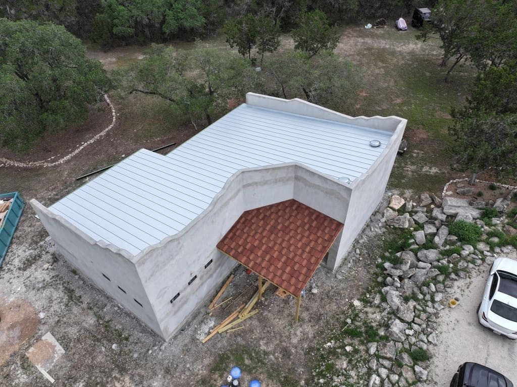 Standing seam metal roof installed by Next Gen Roofing & Construction on a Texas Hill Country home