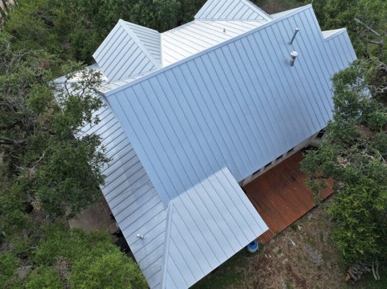 Standing seam metal roof installed by Next Gen Roofing & Construction on a Texas Hill Country home