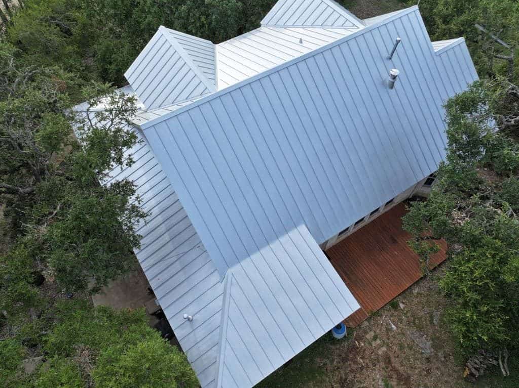 Standing seam metal roof installed by Next Gen Roofing & Construction on a Texas Hill Country home