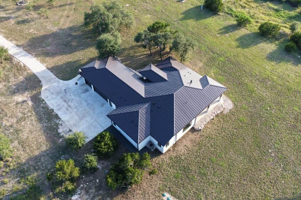 Standing seam metal roof installed by Next Gen Roofing & Construction on a Texas Hill Country home
