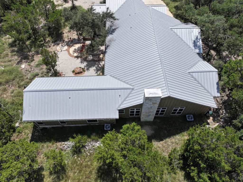 Standing seam metal roof installed by Next Gen Roofing & Construction on a Texas Hill Country home